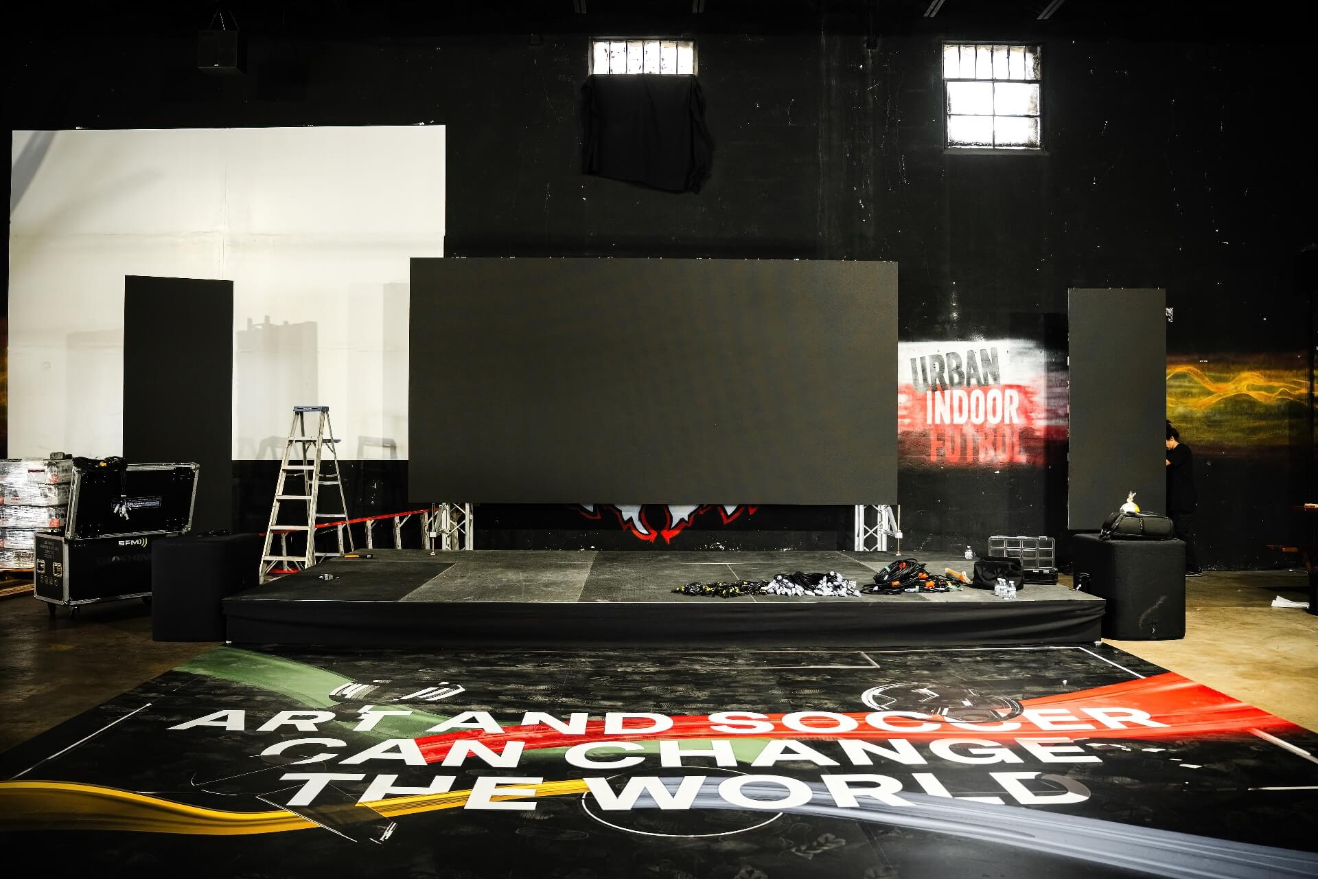 Indoor Event Stage LED Screen Equipment Rental Professional LED video wall and modular stage panel installation inside a venue, offering top-tier event production, corporate audio visual rentals, and live concert concert setup.